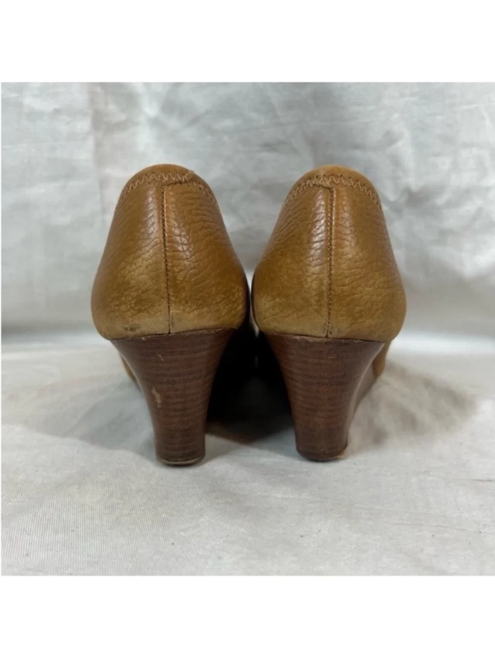 Tory Burch logo round toe brown leather wedge pump